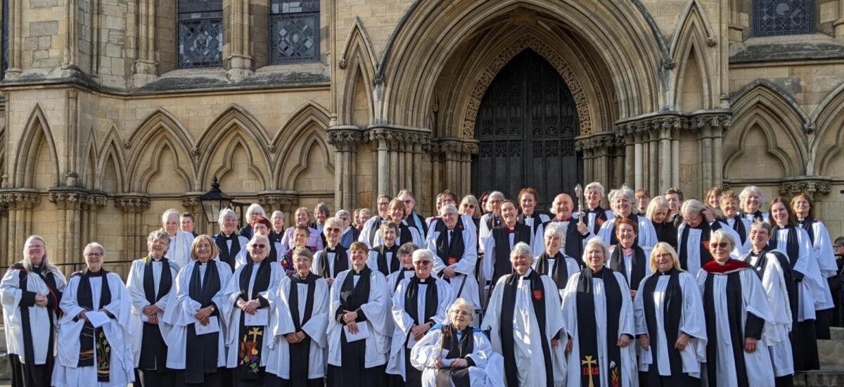 Women priests with Archbishop of York Stephen Cottrell outside York Minster on 4th June 2024