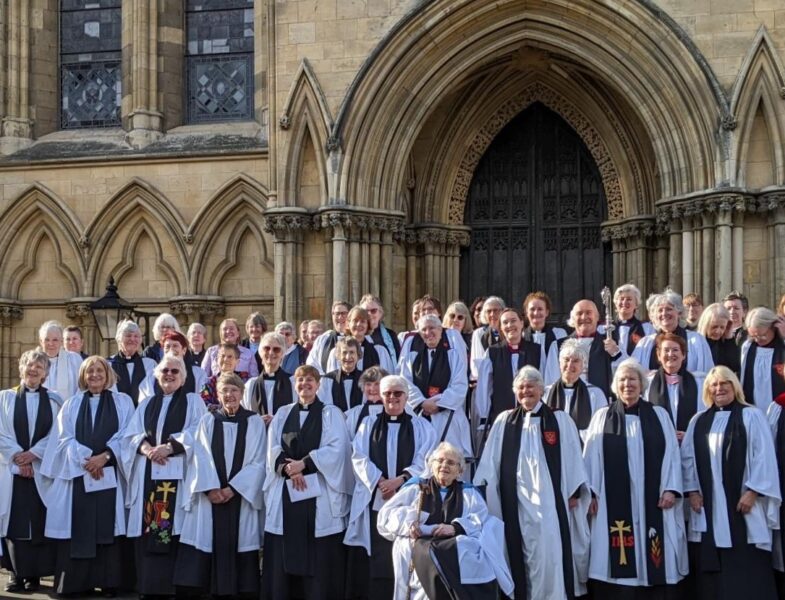 Women priests with Archbishop of York Stephen Cottrell outside York Minster on 4th June 2024