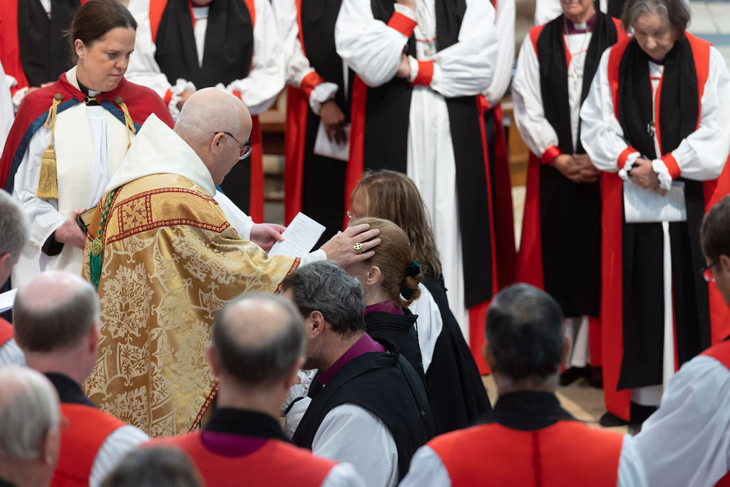 Archbishop Stephen annoints the Rt Revd Dr Flora Winfield