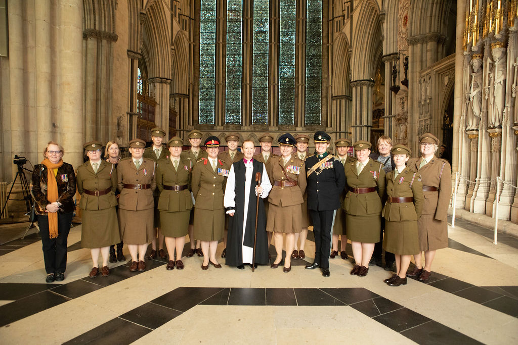 group of people in military-looking uniform