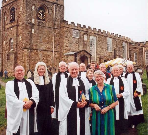 Chris and Margaret Hawthorn after Chris' retirement service in Whitby, July 2001, with the Rural Deans of the Cleveland Archdeaconry