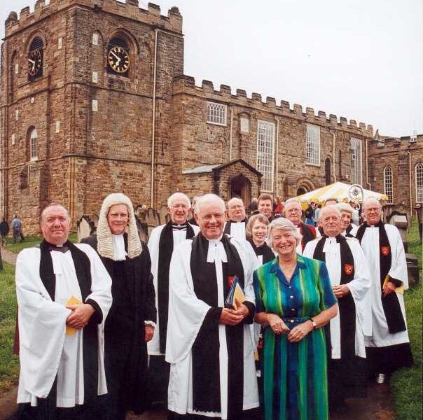 Chris and Margaret Hawthorn after Chris' retirement service in Whitby, July 2001, with the Rural Deans of the Cleveland Archdeaconry