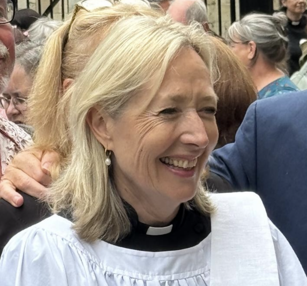 woman in dog collar, smiling