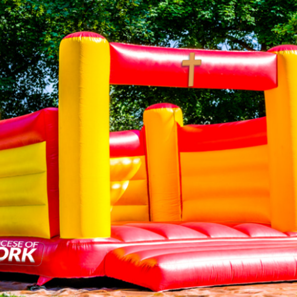 bouncy castle with cross and diocese of york logo