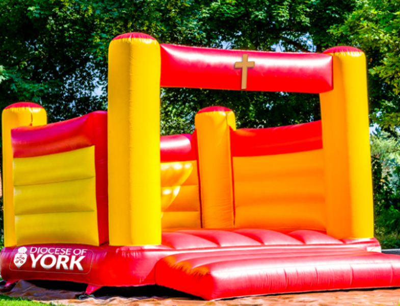 bouncy castle with cross and diocese of york logo