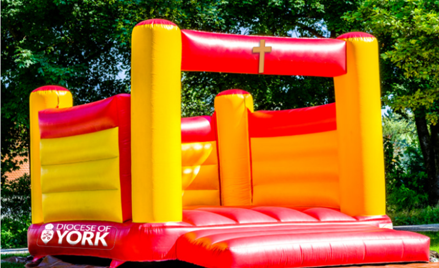 bouncy castle with cross and diocese of york logo